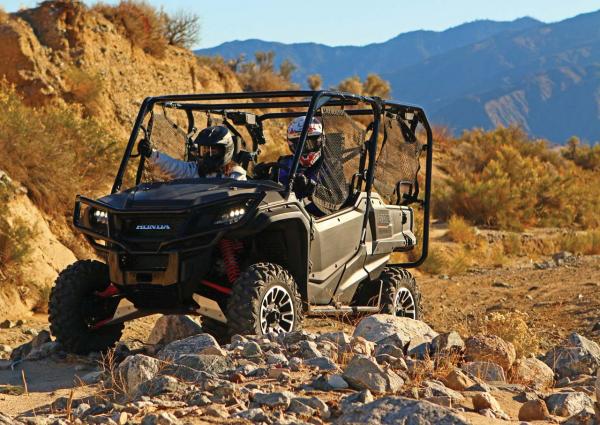 2017.honda_.pioneer1000-5deluxe.grey_.front-left.riding.on-trail.jpg