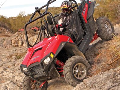2011.polaris.rzr900xp.front-left.red_.riding.down-hill.jpg