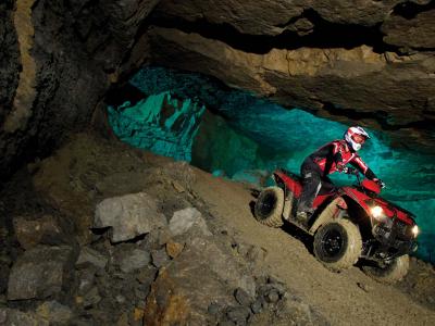 2012.kawasaki.brute-force300.red_.front_.riding.in-cave.jpg
