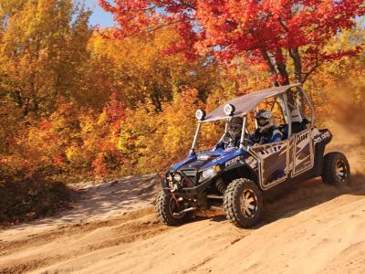 2012.polaris.rzr4_.with-accessories.blue_.front-left.riding.on-dirt.jpg