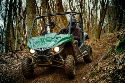 2016.yamaha.wolverine.green.front-left.riding.in-woods.jpg