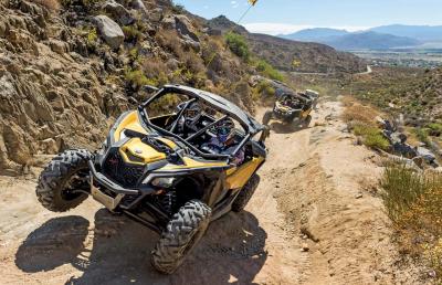 2017.can-am.maverick-x3.front.yellow.riding.on-trail.jpg