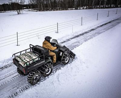 2017.feature.snow-plow-review.atv-plowing-snow.jpg