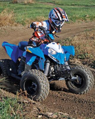 2017.polaris.outlaw110.front-right.blue_.riding.on-dirt.jpg