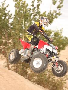 2010.polaris.525s.red_.right_.jumping.in-air.jpg