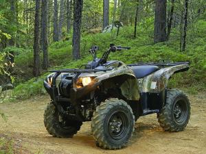 2010.yamaha.grizzly550fi4x4eps.camo_.front-left.parked.on-trail.jpg