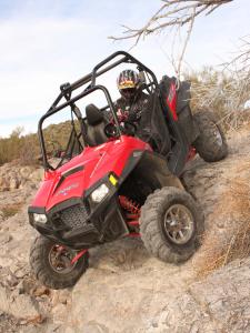 2011.polaris.rzr-xp900.red_.front-left.riding.down-hill.jpg