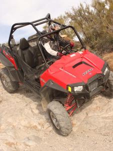 2011.polaris.rzr-xp900.red_.front-right.riding.down-hill.jpg