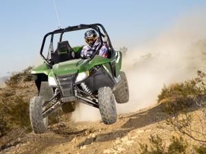 2012.arctic-cat.wildcat1000i-ho.green_.front_.jumping.in-air.jpg
