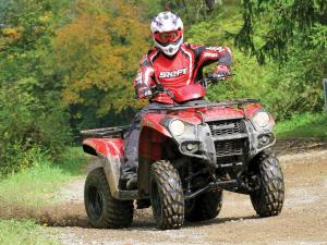 2012.kawasaki.brute-force300.red_.front_.riding.on-trail.jpg