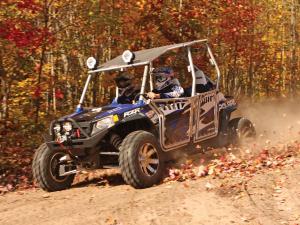 2012.polaris.rzr4_.with-accessories.blue_.front-left.riding.on-trail.jpg