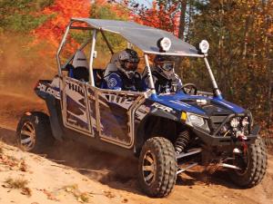 2012.polaris.rzr4_.with-accessories.blue_.front-right.riding.on-trail.jpg