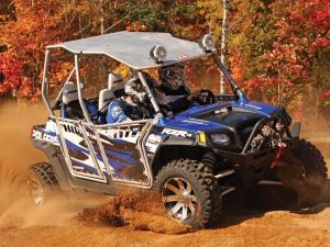 2012.polaris.rzr4_.with-accessories.blue_.right_.riding.on-dirt.jpg