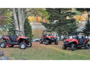2012.polaris.rzr570.red_.front_.parked.by-other-rzrs.jpg