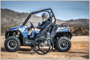 2015.polaris.rzr570efi-custom-mike-young.blue.left.parked.by-wheelchair.jpg
