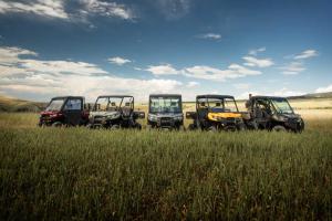 2016.can-am.defender.family.parked.on-grass.jpg