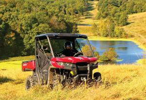 2016.can-am.defender.red.front-right.riding.on-grass.jpg