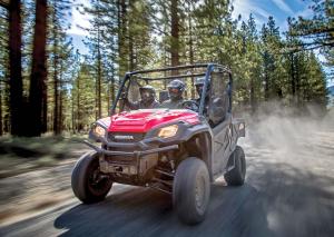 2016.honda.pioneer1000.red.front-left.riding.on-trail.jpg