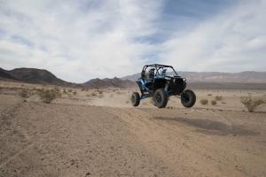 2016.polaris.rzr-xp-turbo-eps.blue_.front-right.jumping.in-air.jpg