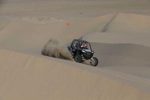 2016.polaris.rzr-xp-turbo-eps.grey_.front-right.riding.at-dunes.jpg