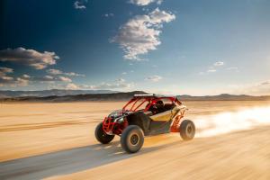 2017.can-am.maverick-x3-xrs-turbo-r.gold.front-left.riding.on-sand.jpg