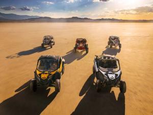 2017.can-am.maverick-x3.front_.group-shot.parked.on-sand.jpg
