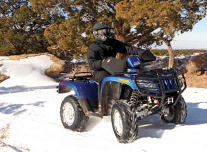 2017.feature.winter-tech-tips.handlebar-boots.on-atv.riding.in-snow.jpg